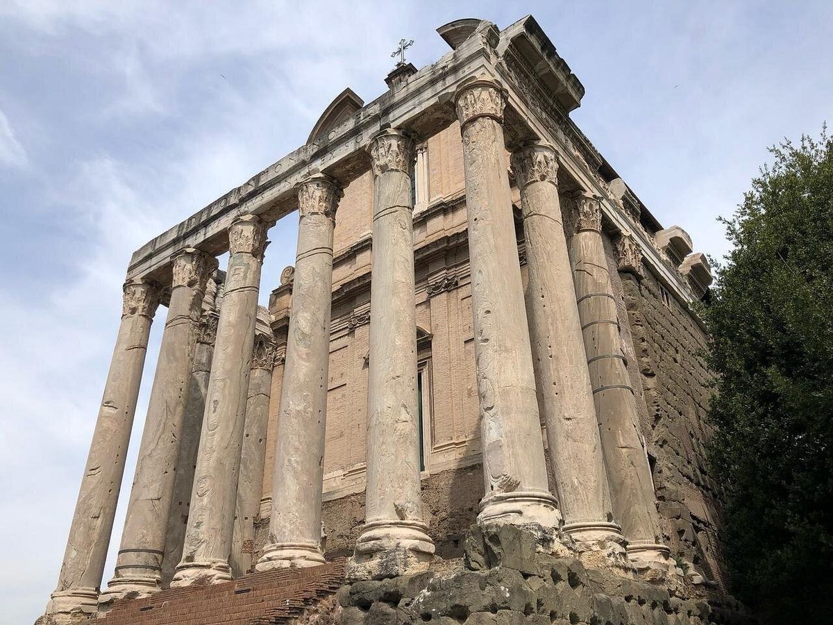 An ancient temple with columns and a portico in the Roman Forum