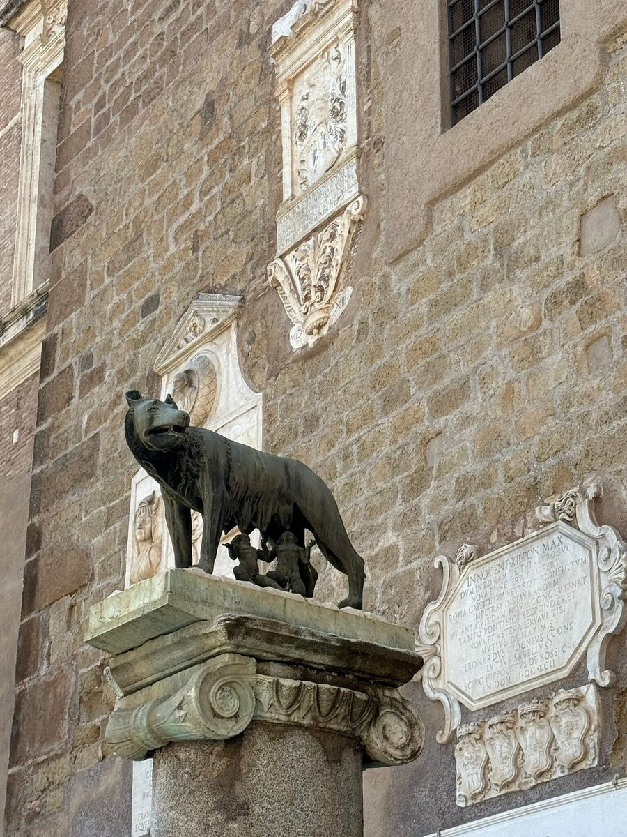 The Capitoline She-wolf on a column by the palace wall