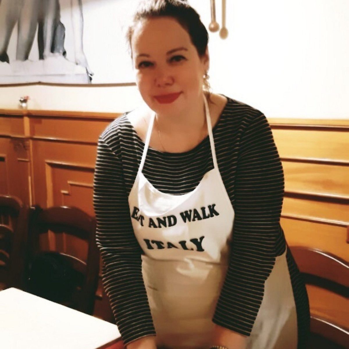 A participant in an apron at a cooking class