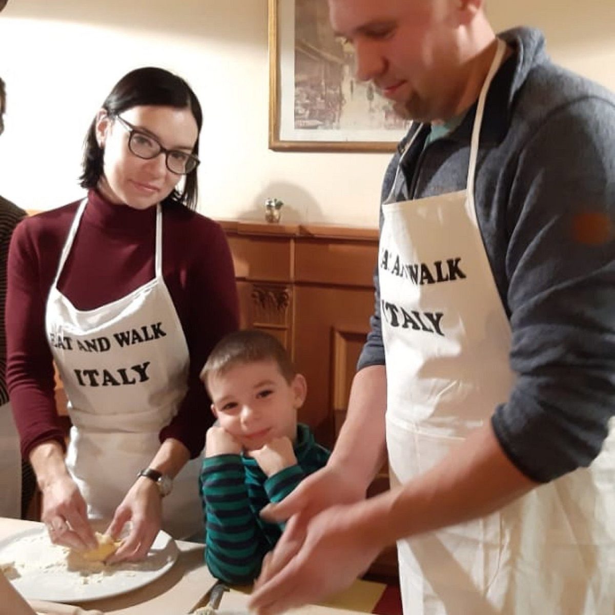 A family rolls out the dough at a pasta class