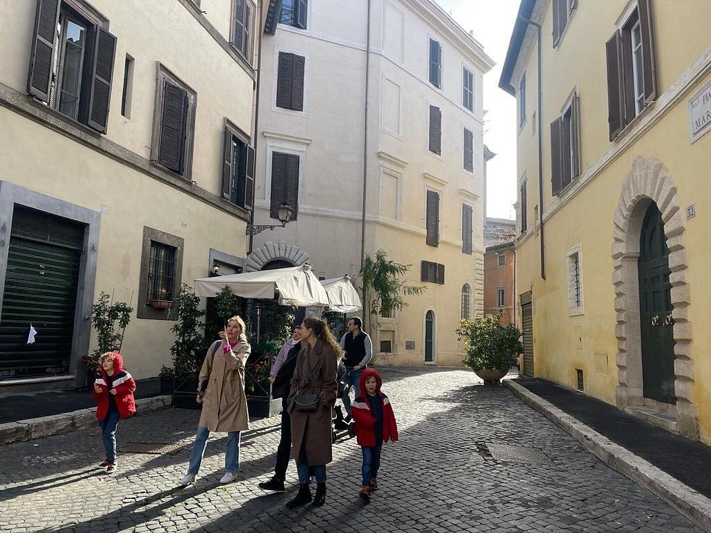 A quiet Roman lane, children walking along the pavement