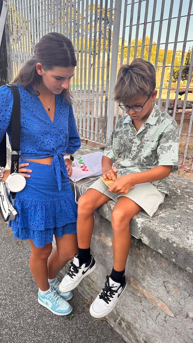 Mother and son rest on the steps